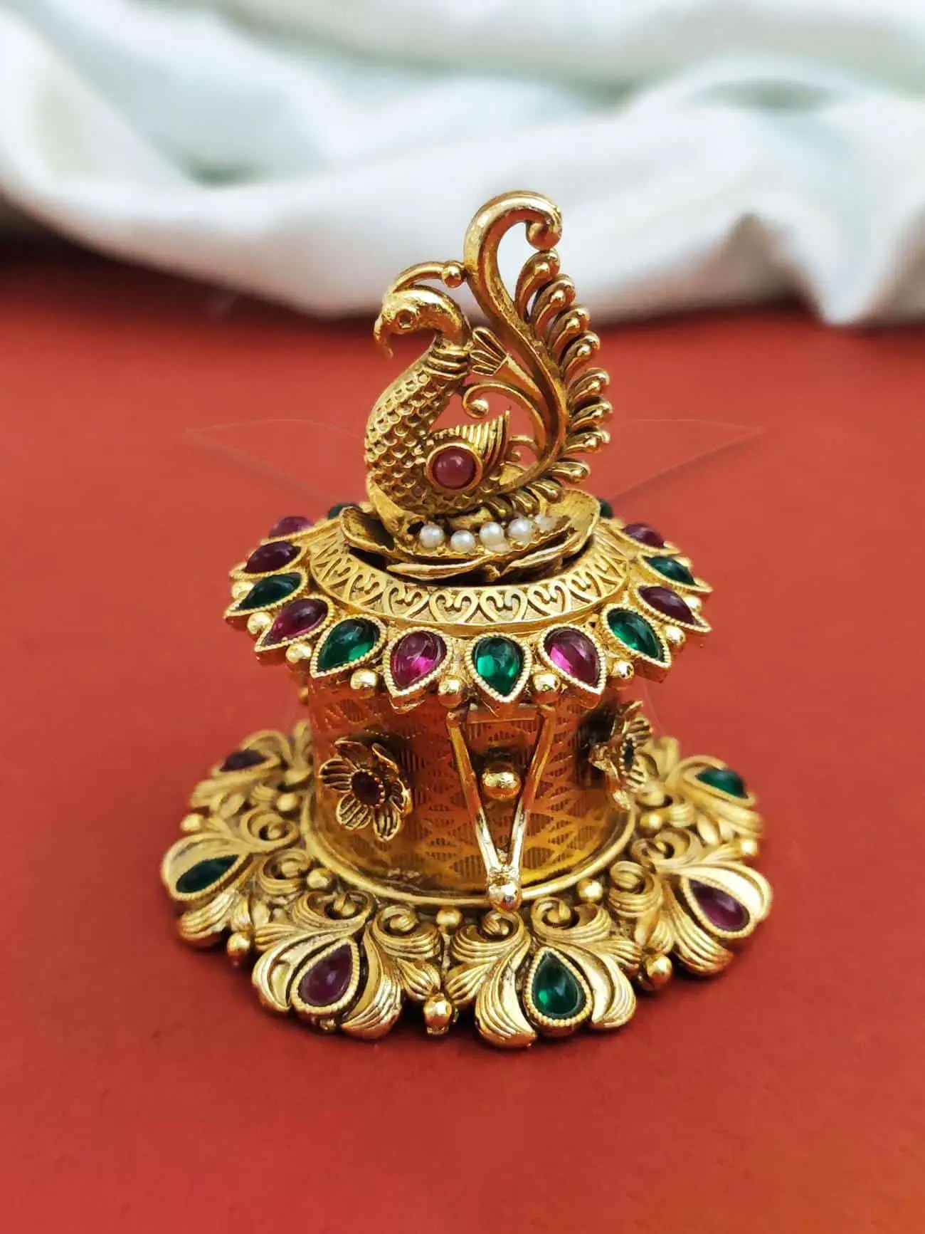 AntiqueSindurbox-Pumiroots-PRSB-25-112 antique peacock sindoor box, gold with stones