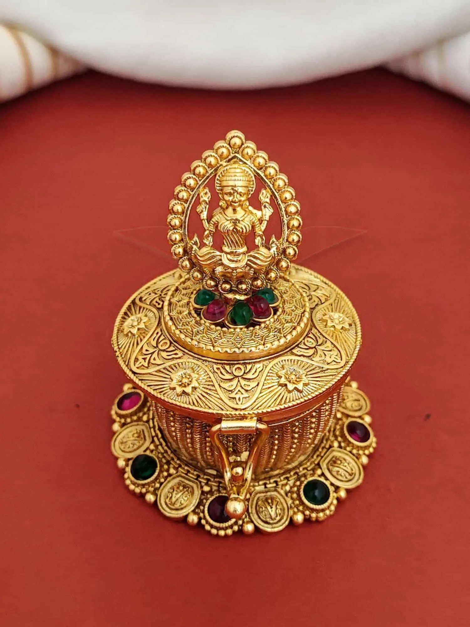 AntiqueSindurbox-Pumiroots-PRSB-25-166 round Laxmi sindoor box, gold with stones