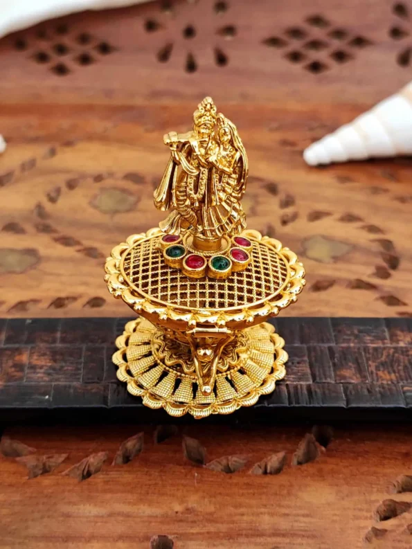 Radha Krishna sindoor box, gold temple style with idol and stones