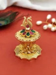 peacock sindoor box, gold plated with stones