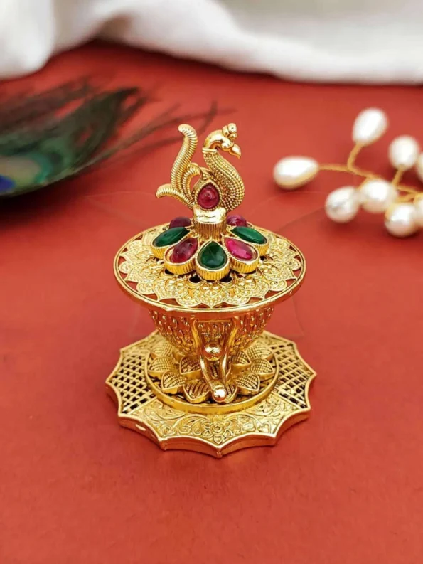 peacock sindoor box, gold plated with stones