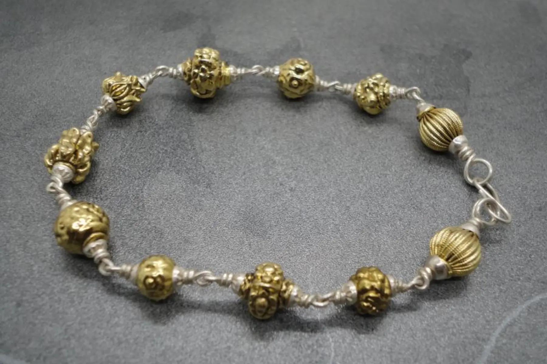 Pumiroots-AyyappanPooja-MALA-B-LAVA-C-G-1 Jwalamukhi lava bracelet, golden lava stone cuff